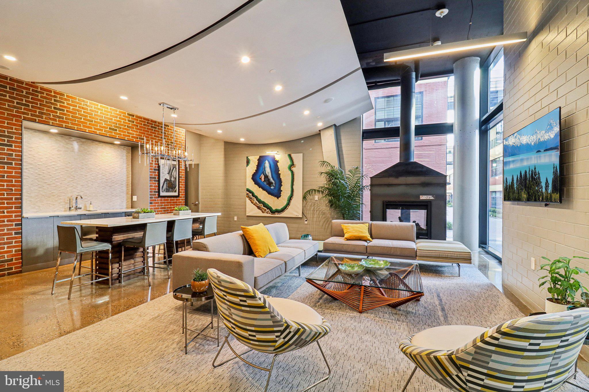 2125 14th Street Northwest, Unit 322 Washington, DC 20009 - Photo 9 of 37 a living room with furniture and a fireplace