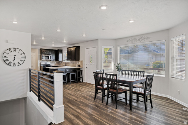 892 East 400 South Smithfield, UT 84335 - Photo 7 of 44 Dining room with dark wood-style floors and recessed lighting