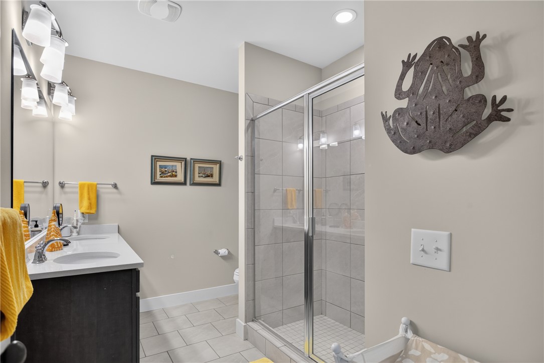 112 Tuttle Street Clemson, SC 29631 - Photo 26 of 46 Dual vanity sinks complement a spacious walk-in shower in this well-appointed bathroom.