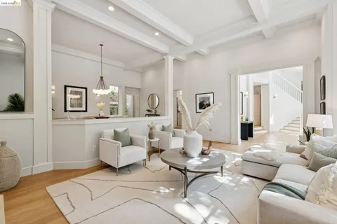 a dining room with furniture window and wooden floor