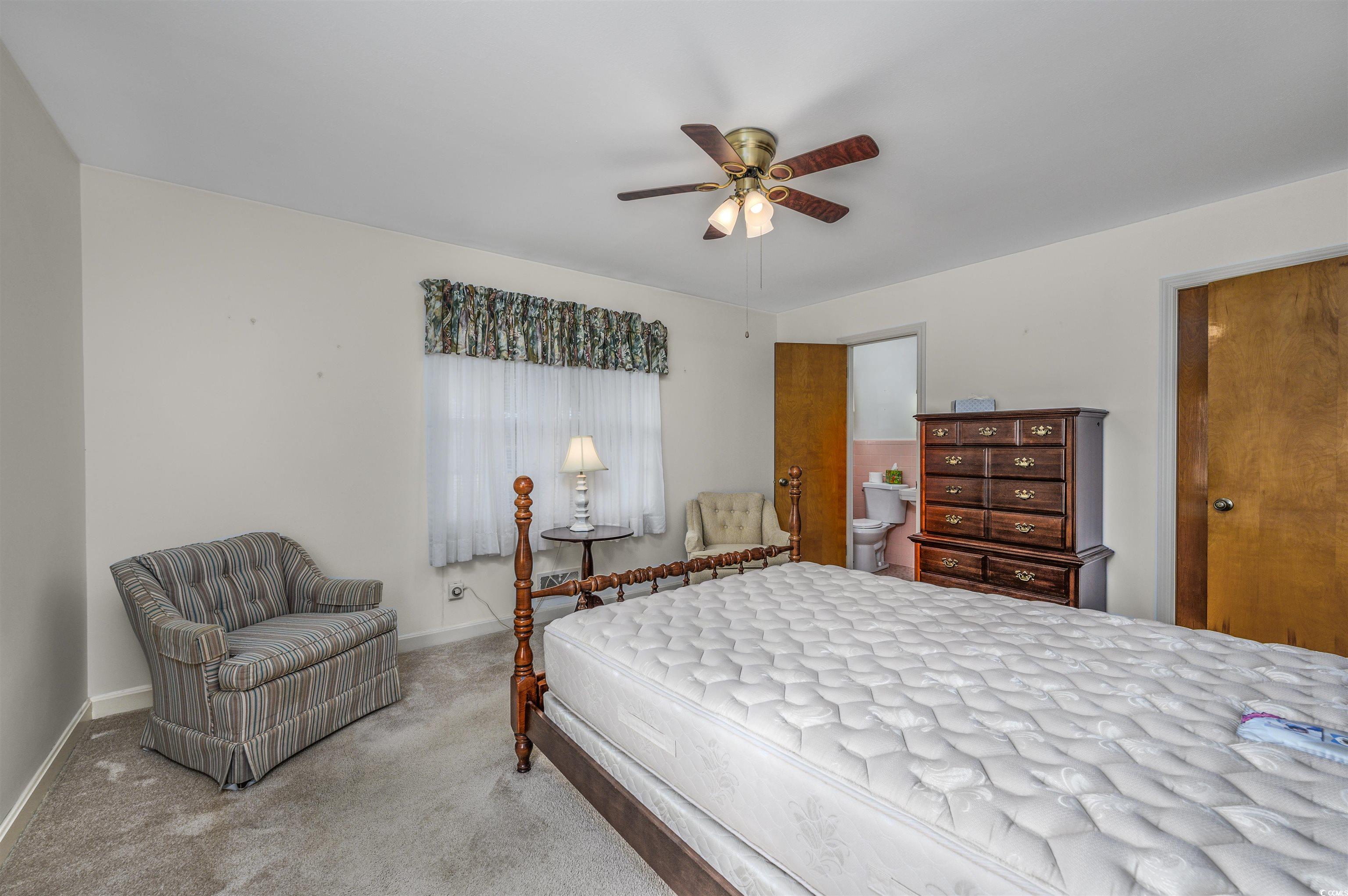 1870 Highway 348 Loris, SC 29569 - Photo 16 of 34 Carpeted bedroom featuring ceiling fan and baseboards