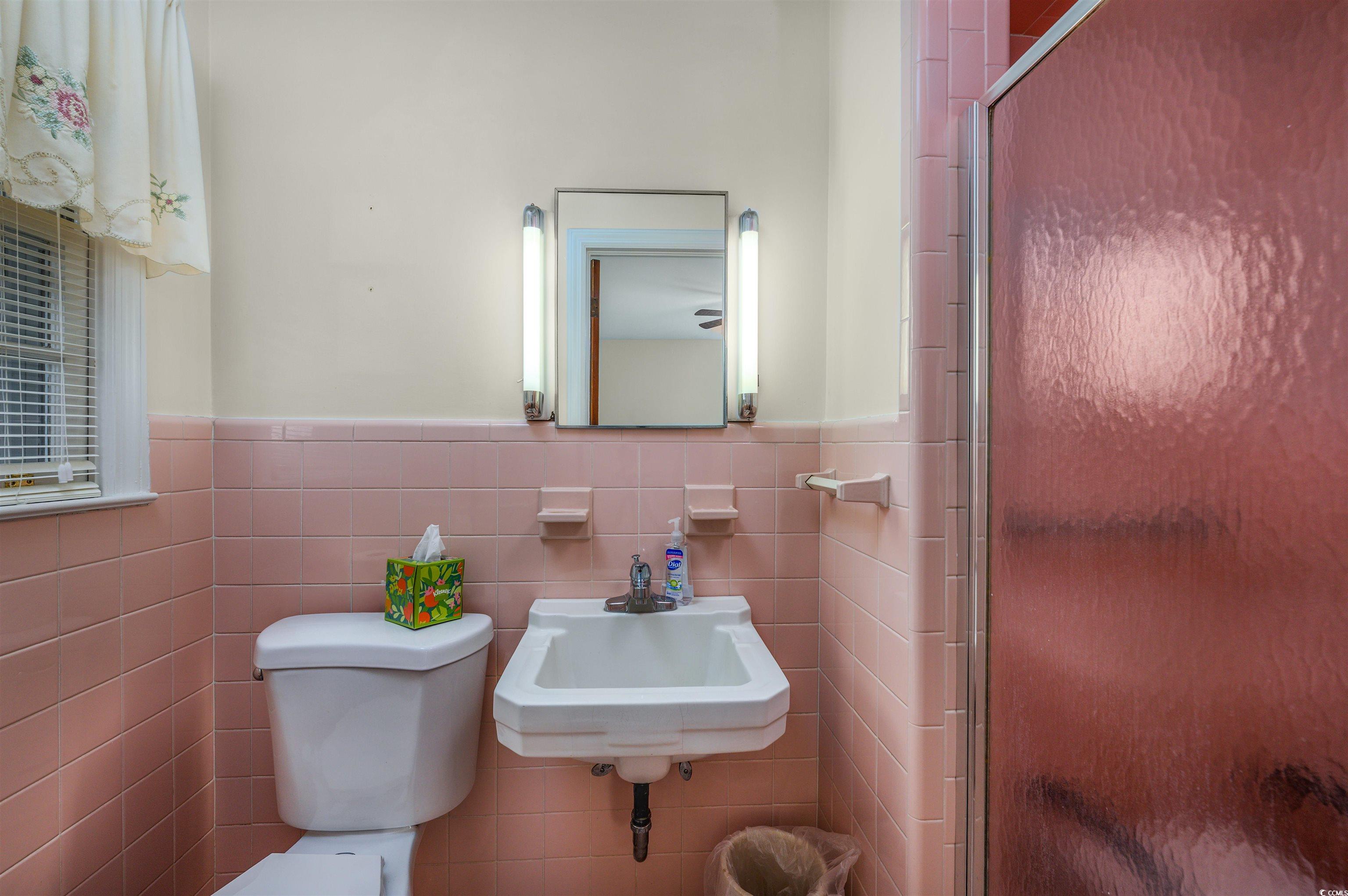 1870 Highway 348 Loris, SC 29569 - Photo 17 of 34 Bathroom with wainscoting, a shower stall, and tile walls