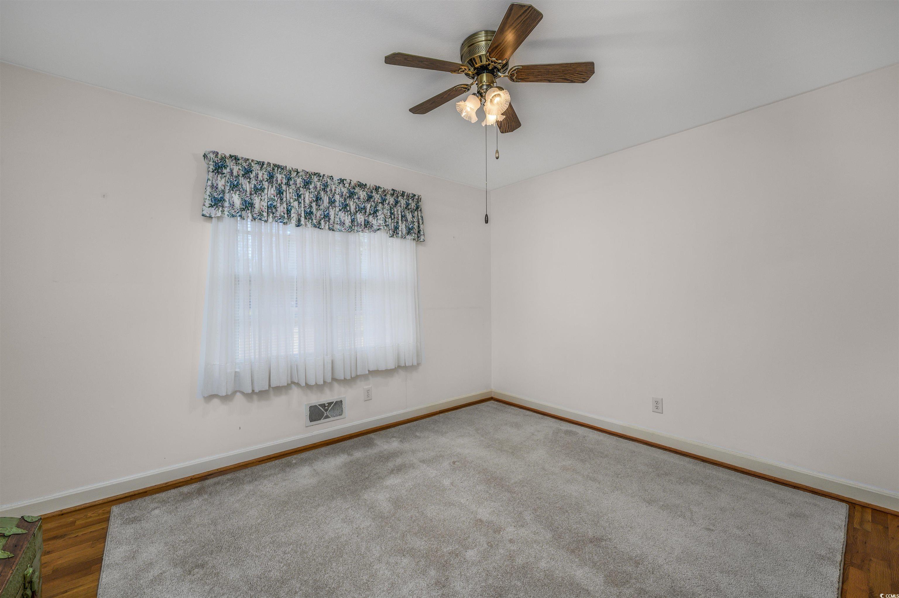 1870 Highway 348 Loris, SC 29569 - Photo 18 of 34 Spare room featuring wood finished floors and ceiling fan