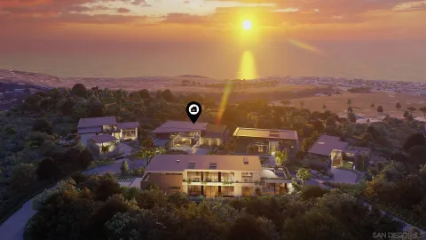 an aerial view of residential houses with outdoor space