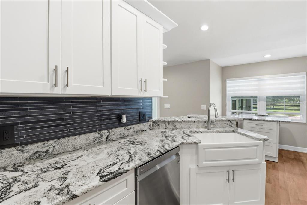 20781 Southwest 90th Loop Dunnellon, FL 34431 - Photo 12 of 46 a kitchen with a sink and cabinets