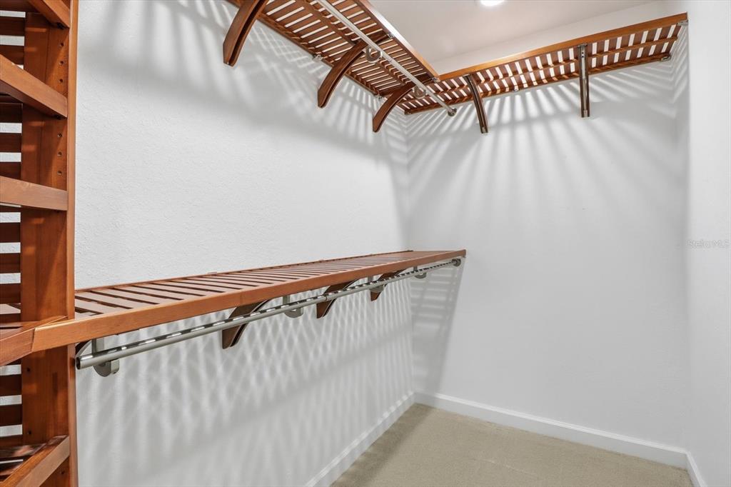 20781 Southwest 90th Loop Dunnellon, FL 34431 - Photo 19 of 46 a view of walk in closet with clothes