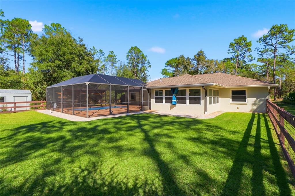 20781 Southwest 90th Loop Dunnellon, FL 34431 - Photo 34 of 46 a view of a house with a backyard