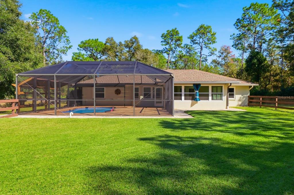 20781 Southwest 90th Loop Dunnellon, FL 34431 - Photo 35 of 46 a front view of a house with a garden