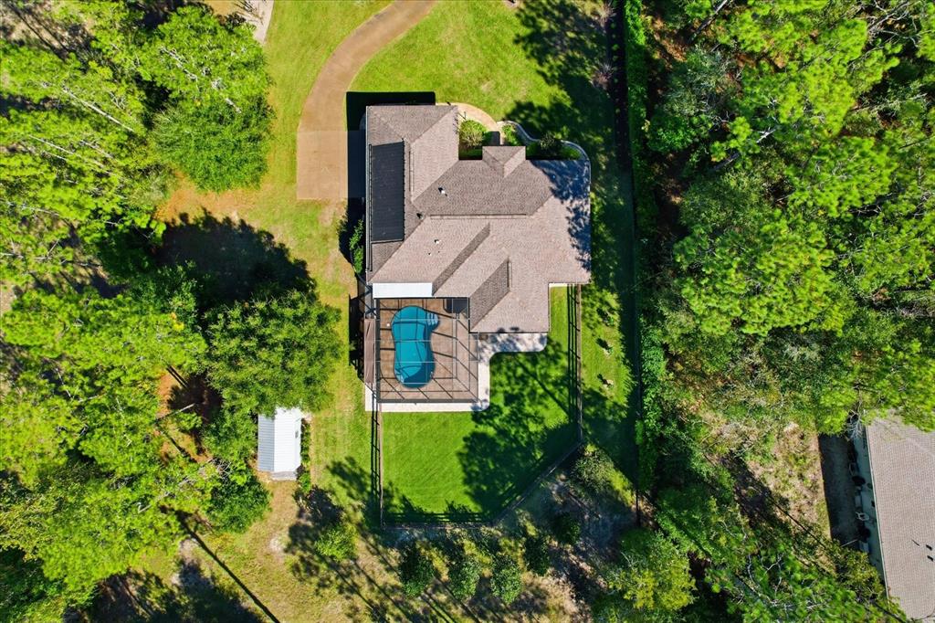 20781 Southwest 90th Loop Dunnellon, FL 34431 - Photo 41 of 46 an aerial view of a house with a yard