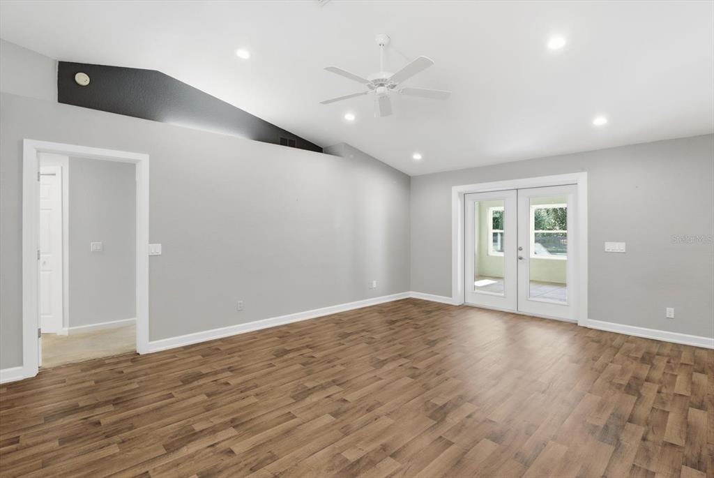 20781 Southwest 90th Loop Dunnellon, FL 34431 - Photo 6 of 46 a view of an empty room with wooden floor