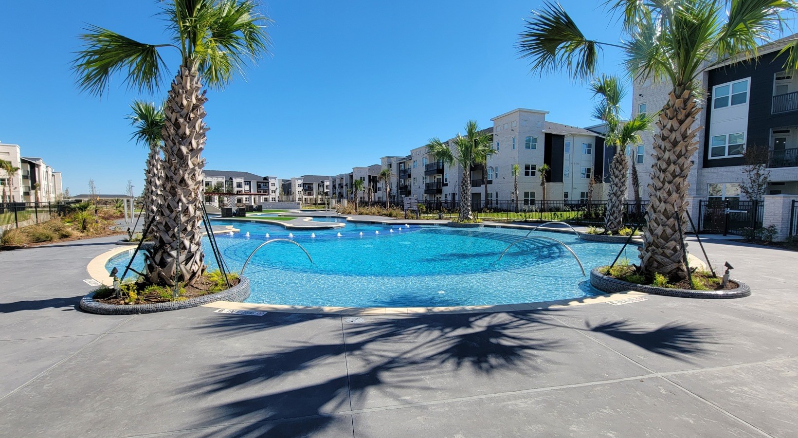 7100 Uvalde Road, Unit 2203 Houston, TX 77049 - Photo 23 of 28 a view of a park with palm trees