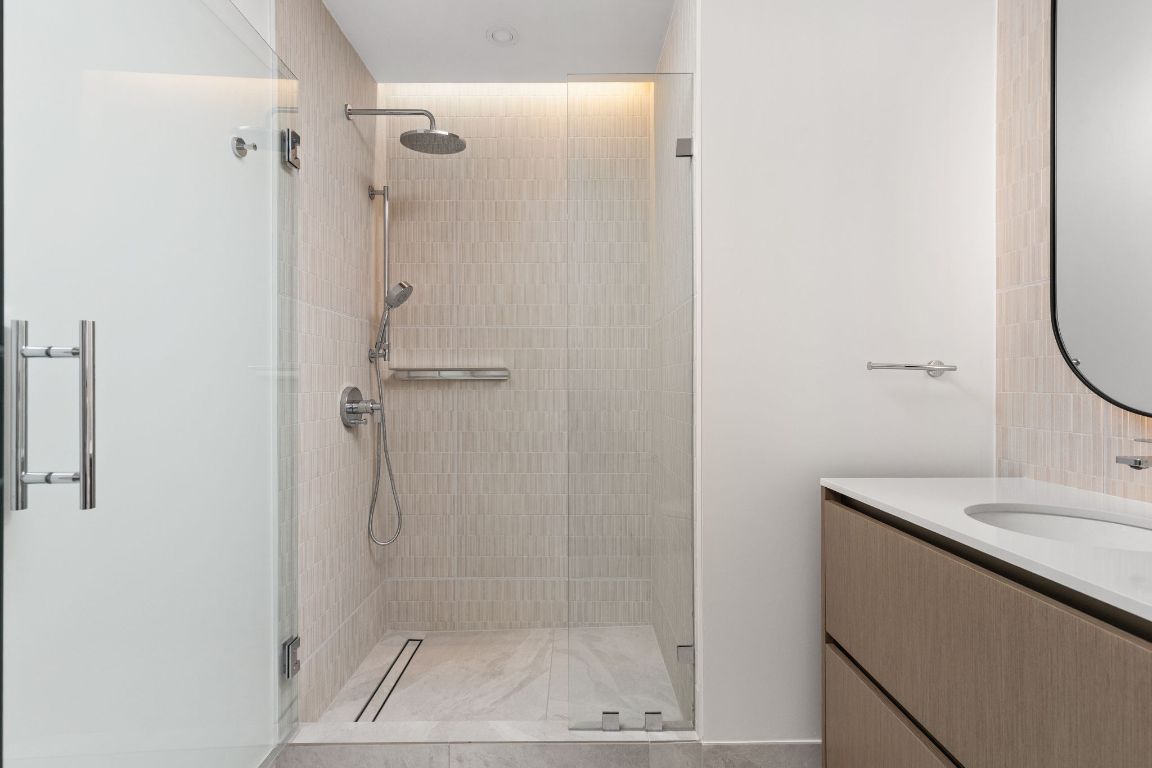 610 Davis Street, Unit 4008 Austin, TX 78701 - Photo 15 of 40 a bathroom with a shower and a sink