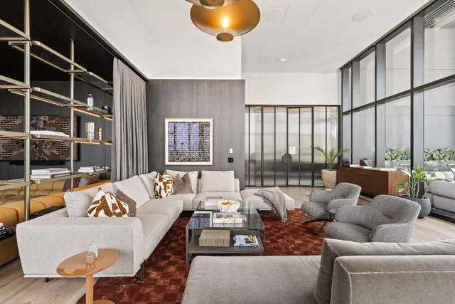 a bedroom with furniture and wooden floor