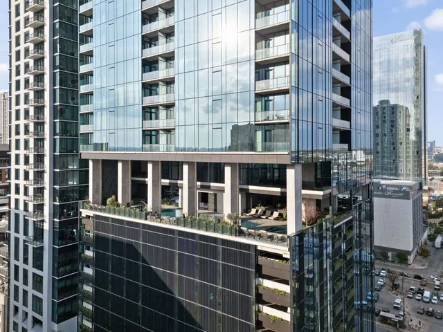 a swimming pool with outdoor seating