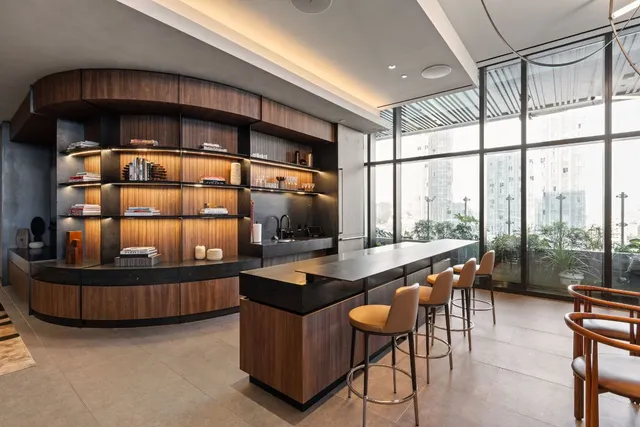 a view of a patio with table and chairs potted plants