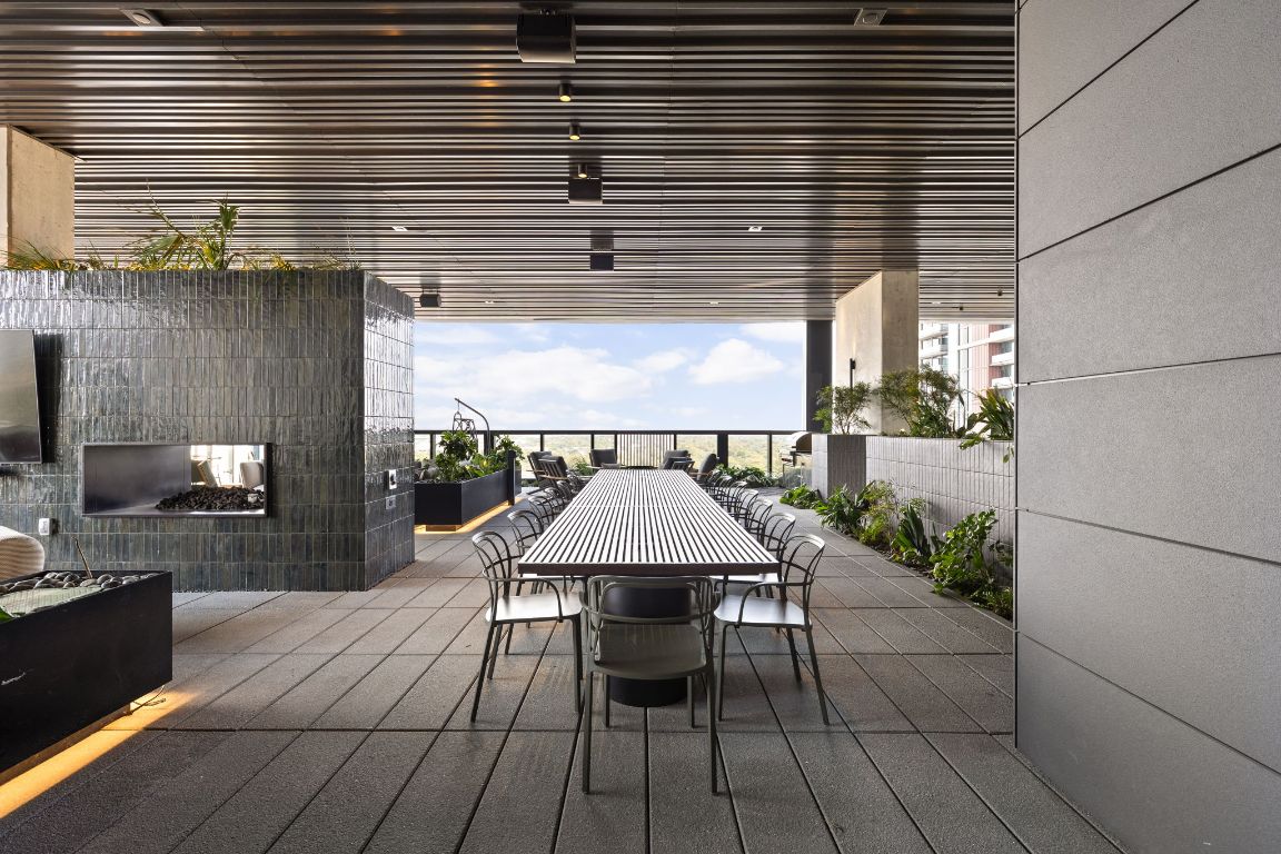 610 Davis Street, Unit 4008 Austin, TX 78701 - Photo 39 of 40 a view of a patio with table and chairs potted plants
