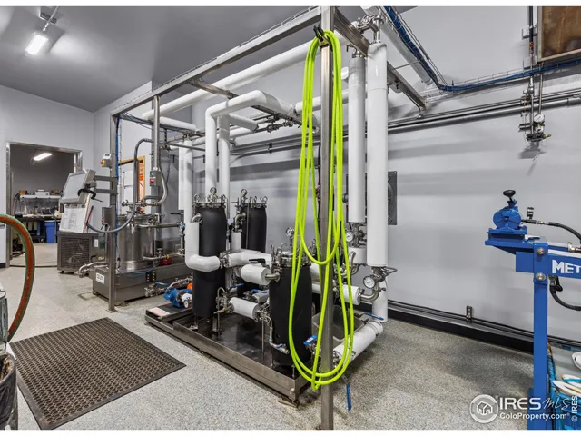 a view of a hallway with a dining area