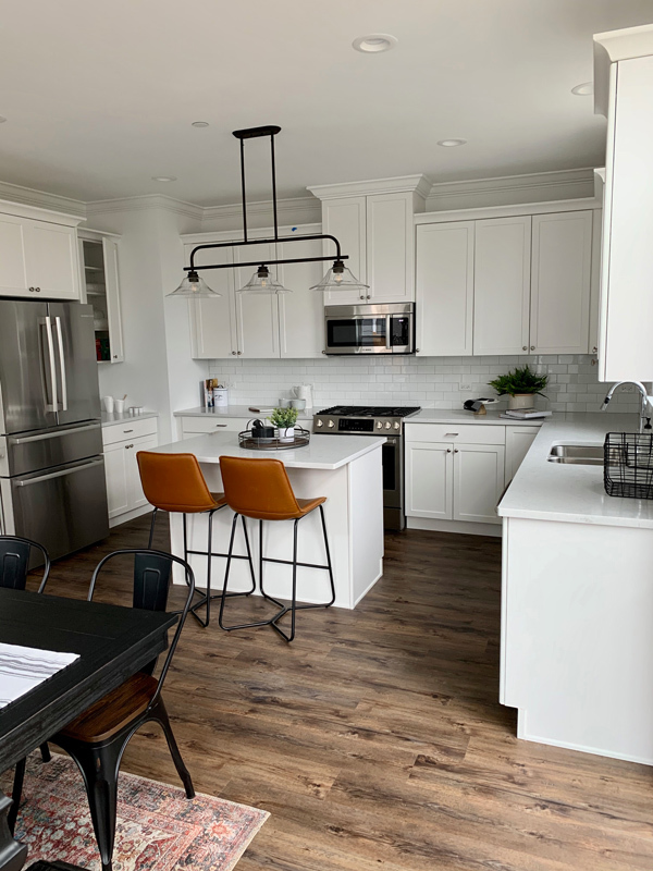 1751 Winnetka Road, Unit C Northfield, IL 60093 - Photo 2 of 6 a kitchen with stainless steel appliances kitchen island granite countertop a sink a stove a refrigerator and cabinets