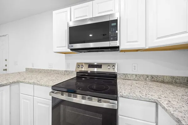 a view of a kitchen with a sink