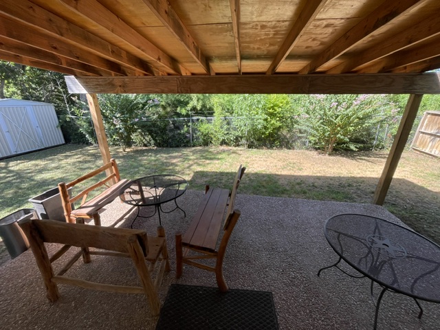 4611 Glissman Road Austin, TX 78702 - Photo 11 of 11 An inviting covered patio offers a private outdoor retreat with ample yard space.