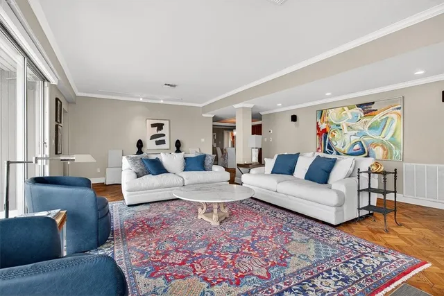 a living room with furniture and a rug