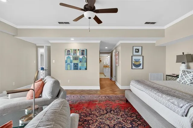 a living room with furniture and a rug