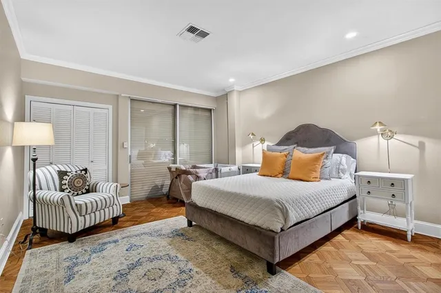 a bedroom with a bed and a couch