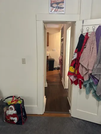 a room with hard wood floors and a window