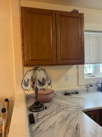 a view of a storage and utility room with a window