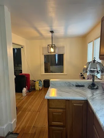 a kitchen with a sink dishwasher a stove and a microwave oven