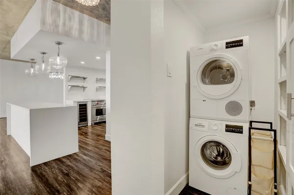 a view of a hallway with washer and dryer