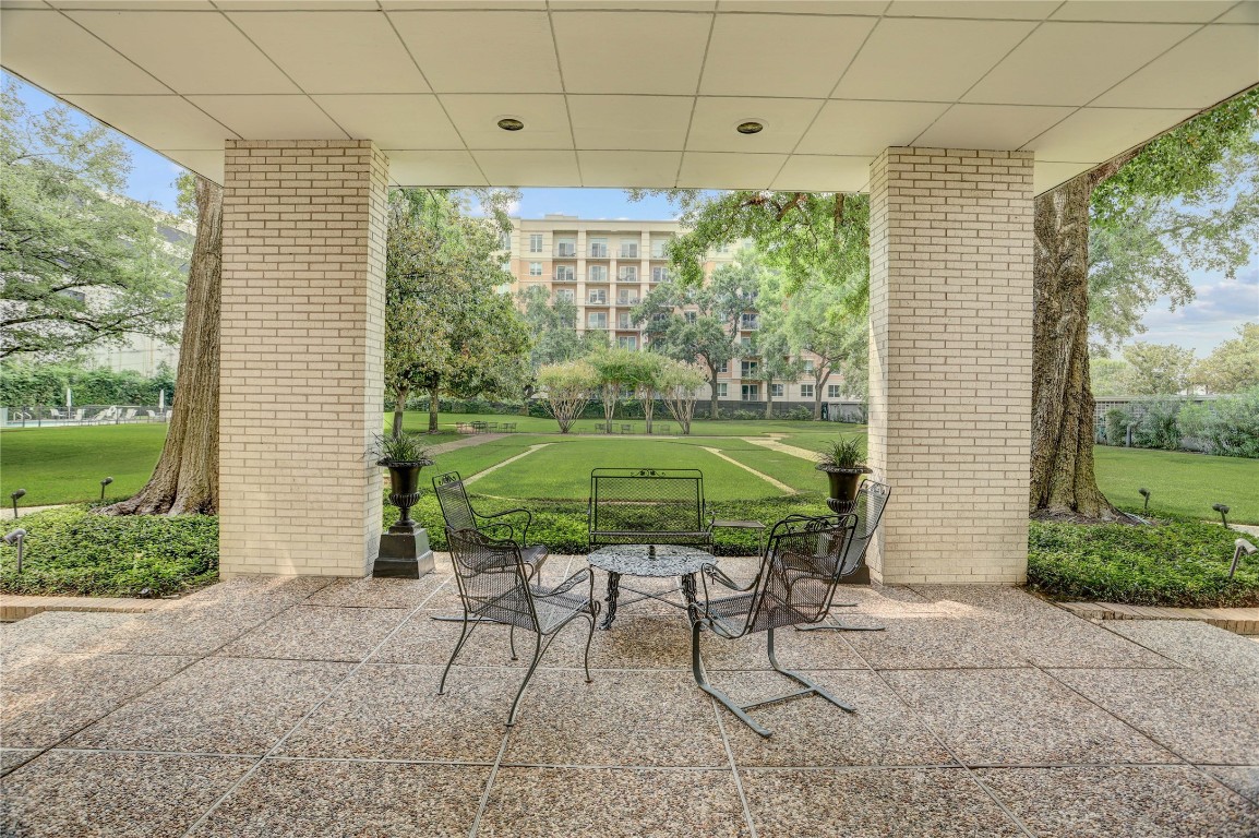 2701 Westheimer Road, Unit 12E Houston, TX 77098 - Photo 22 of 31 a garden view with a seating space