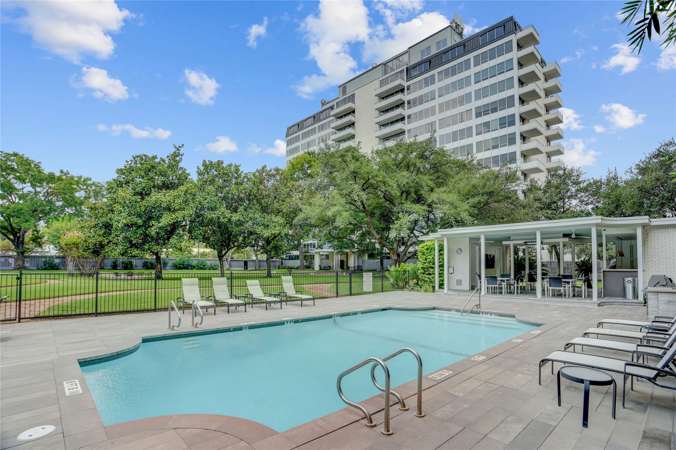 2701 Westheimer Road, Unit 12E Houston, TX 77098 - Photo 24 of 31 a view of a swimming pool with a patio