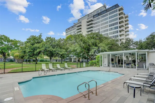 a view of a swimming pool with a patio