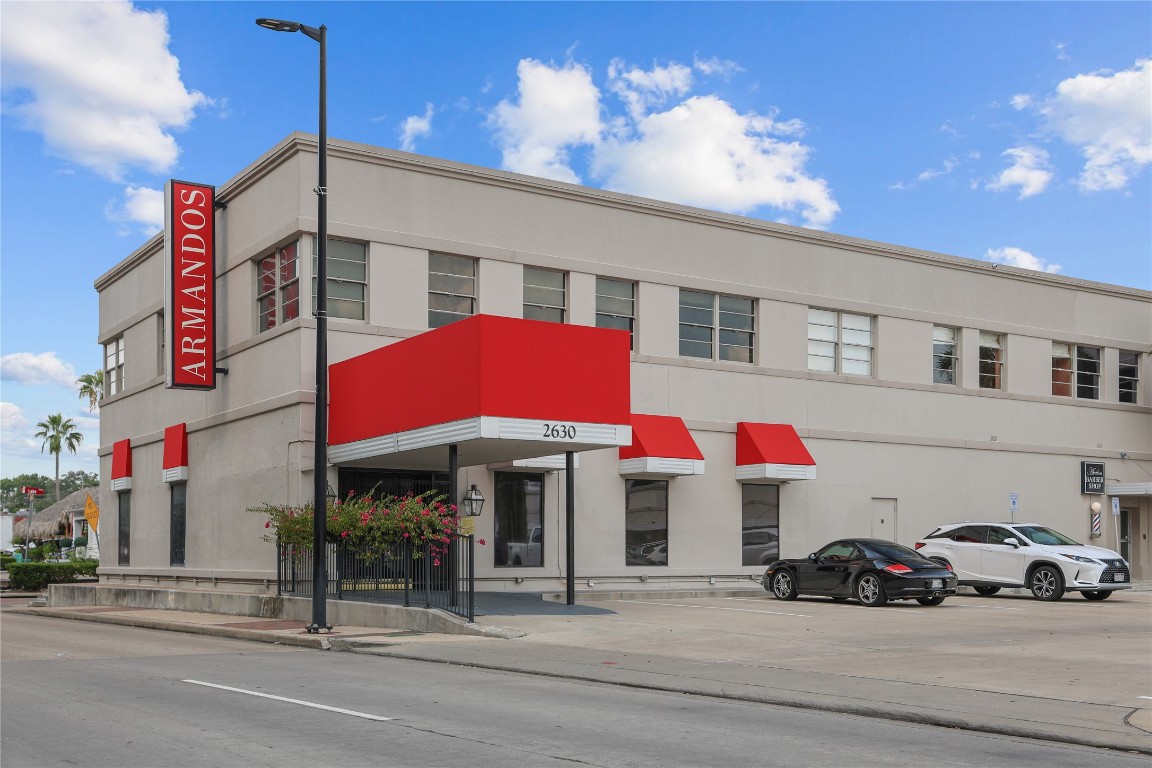 2701 Westheimer Road, Unit 12E Houston, TX 77098 - Photo 29 of 31 a front view of a building with street view