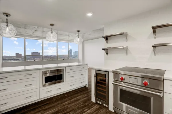 a kitchen with a stove and a sink