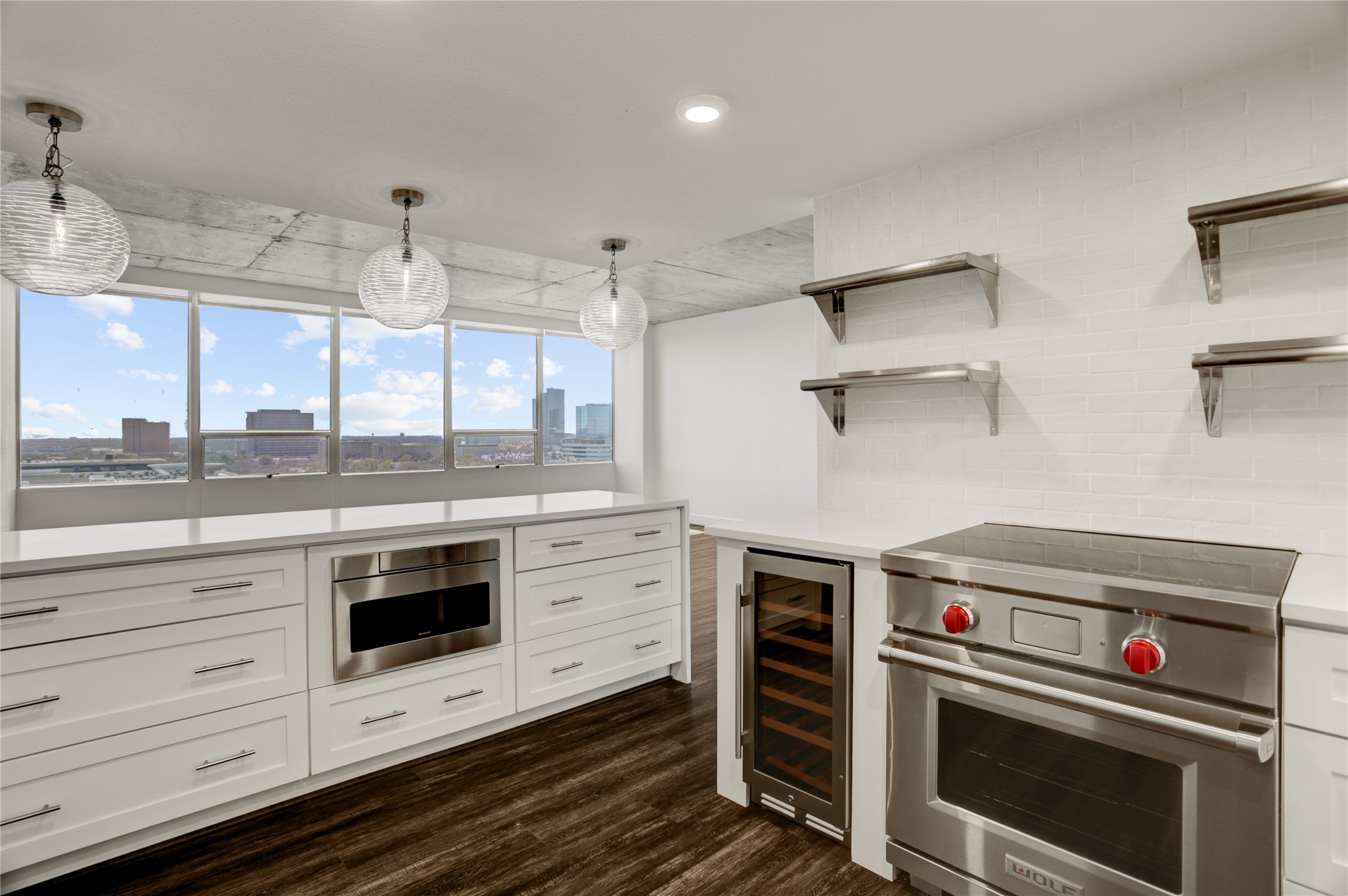 2701 Westheimer Road, Unit 12E Houston, TX 77098 - Photo 5 of 31 a kitchen with a stove and a sink
