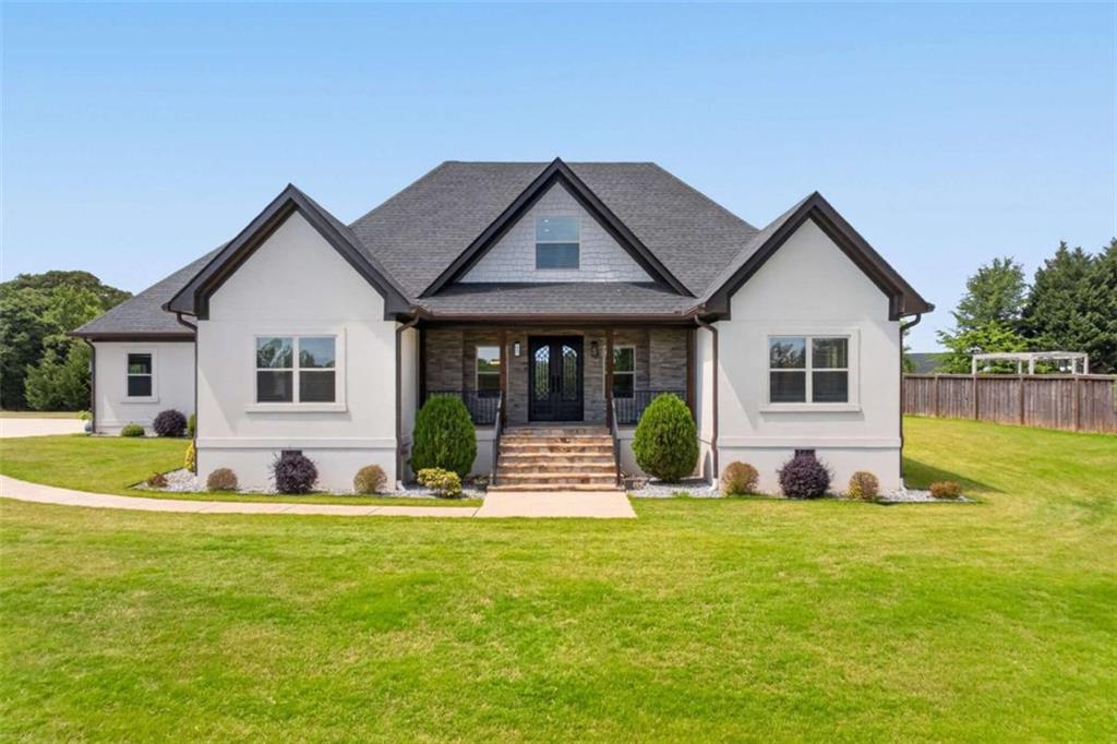 719 Austin Reynolds Road Bethlehem, GA 30620 - Photo 1 of 68 a front view of house with yard and green space