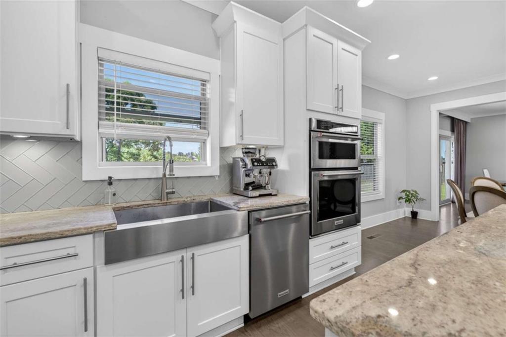 719 Austin Reynolds Road Bethlehem, GA 30620 - Photo 19 of 68 a kitchen with stainless steel appliances granite countertop a sink a stove and cabinets