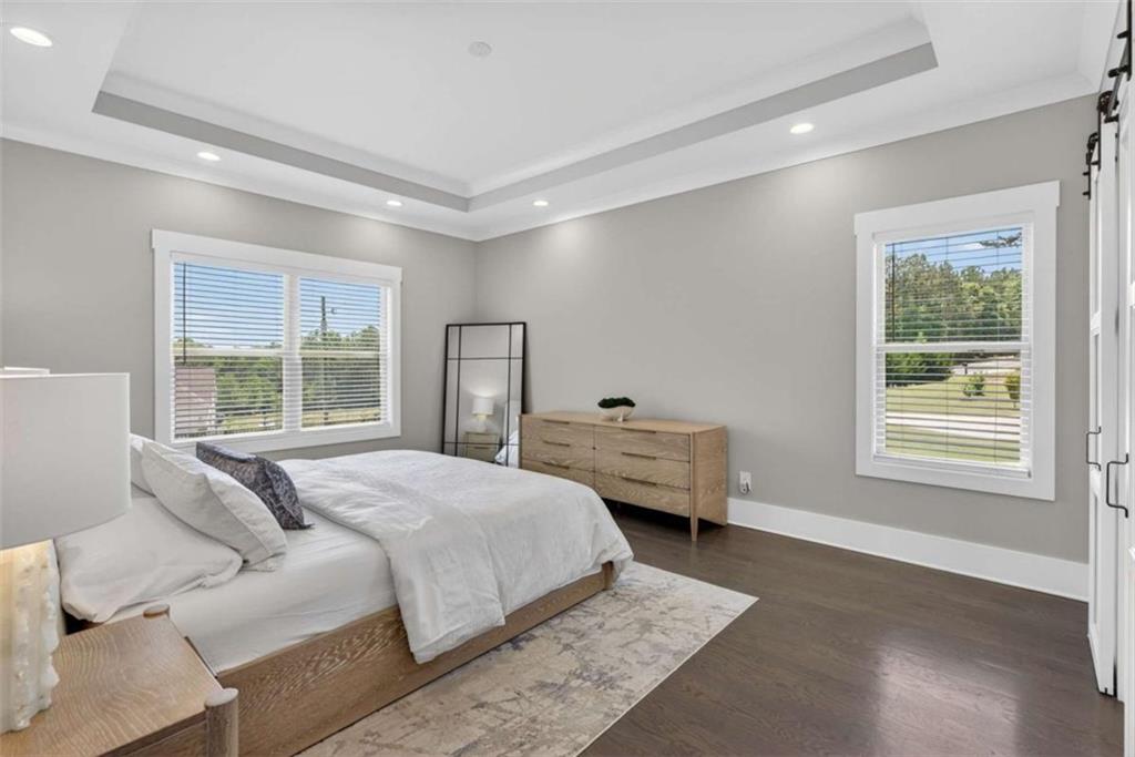 719 Austin Reynolds Road Bethlehem, GA 30620 - Photo 22 of 68 a bedroom with a bed and wooden floor