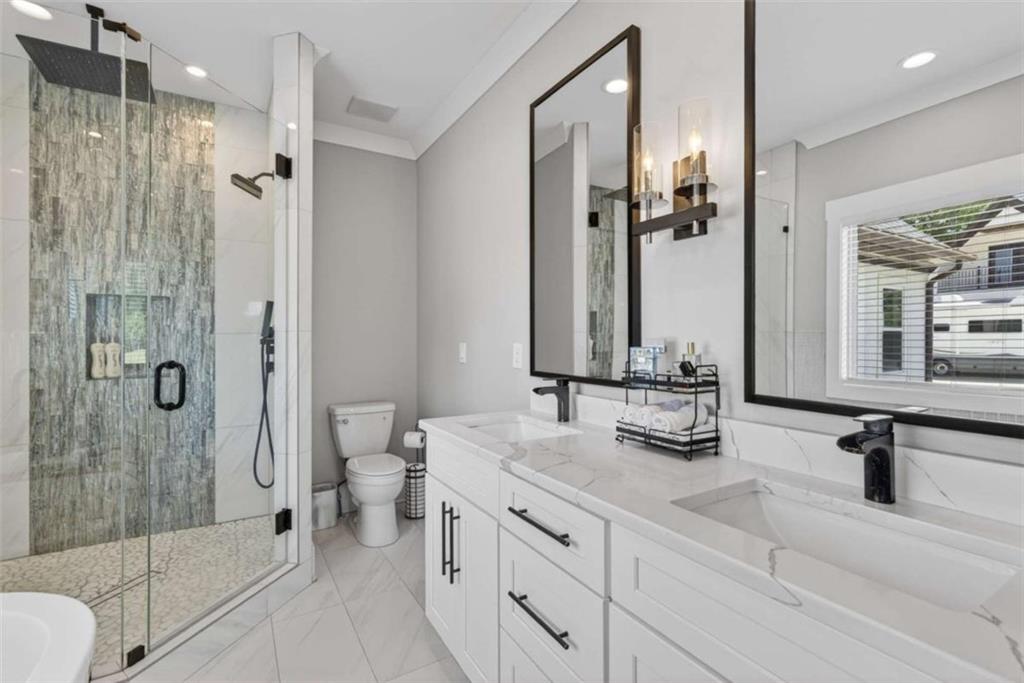 719 Austin Reynolds Road Bethlehem, GA 30620 - Photo 26 of 68 a bathroom with double vanity and a shower