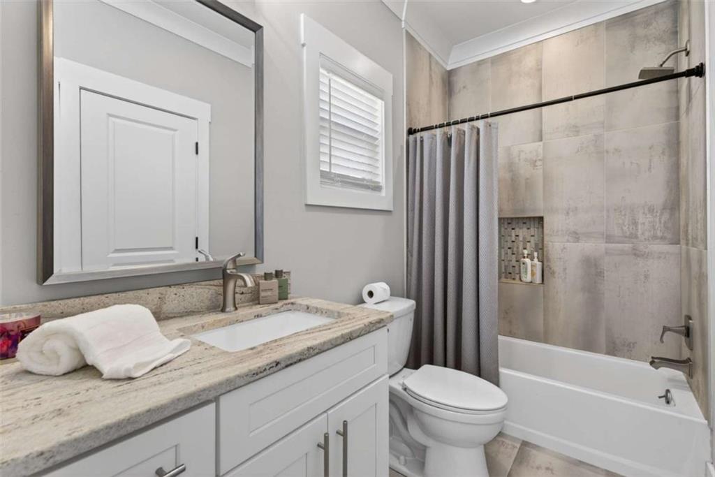 719 Austin Reynolds Road Bethlehem, GA 30620 - Photo 34 of 68 a bathroom with a granite countertop sink toilet and shower