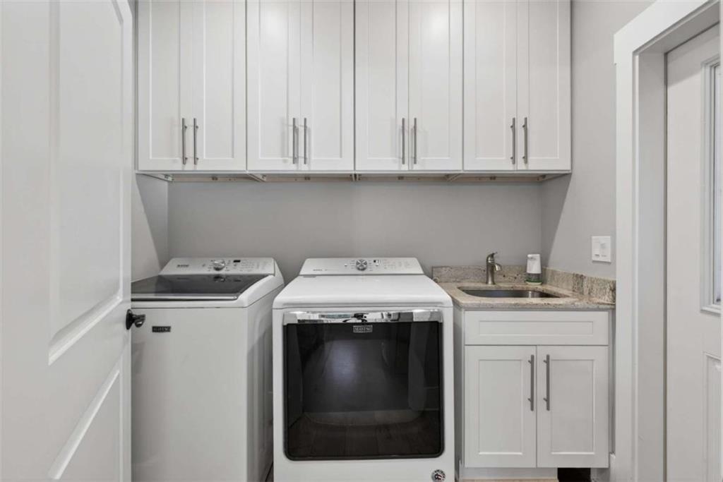 719 Austin Reynolds Road Bethlehem, GA 30620 - Photo 39 of 68 a kitchen with granite countertop white cabinets and white appliances