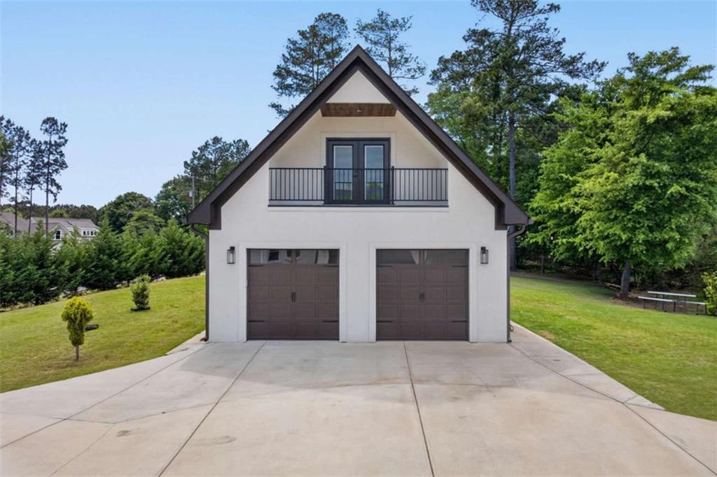 719 Austin Reynolds Road Bethlehem, GA 30620 - Photo 46 of 68 a view of a house with a yard and garage
