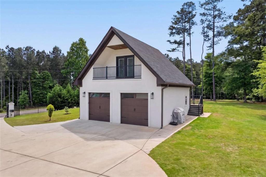 719 Austin Reynolds Road Bethlehem, GA 30620 - Photo 47 of 68 a view of a house with backyard and trees