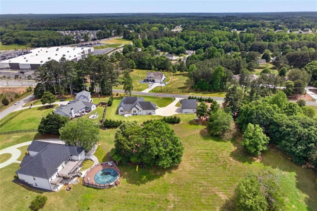719 Austin Reynolds Road Bethlehem, GA 30620 - Photo 67 of 68 an aerial view of a house with yard swimming pool and outdoor seating
