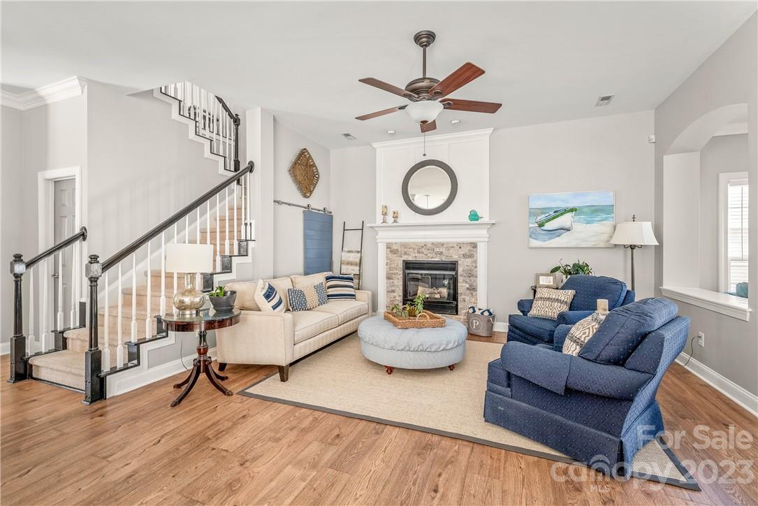 4108 Cedar Point Avenue Matthews, NC 28104 - Photo 17 of 41 a living room with furniture and a fireplace