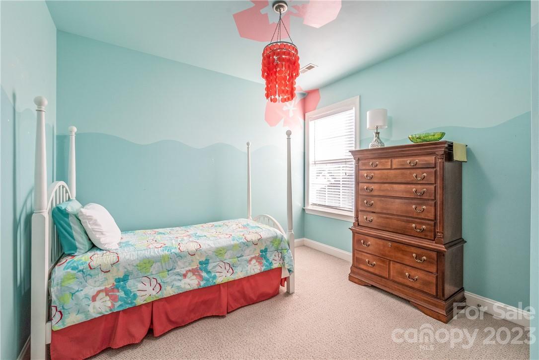 4108 Cedar Point Avenue Matthews, NC 28104 - Photo 28 of 41 a bedroom with a bed and a dresser