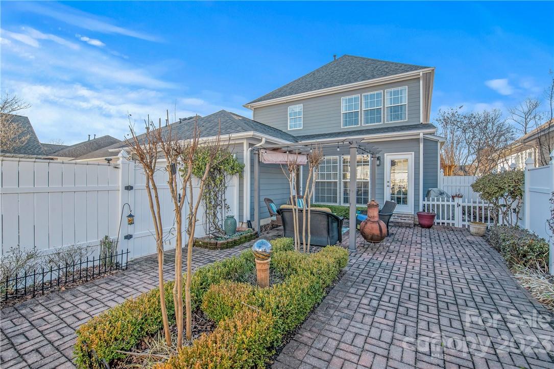 4108 Cedar Point Avenue Matthews, NC 28104 - Photo 31 of 41 a view of a house with backyard sitting area and garden