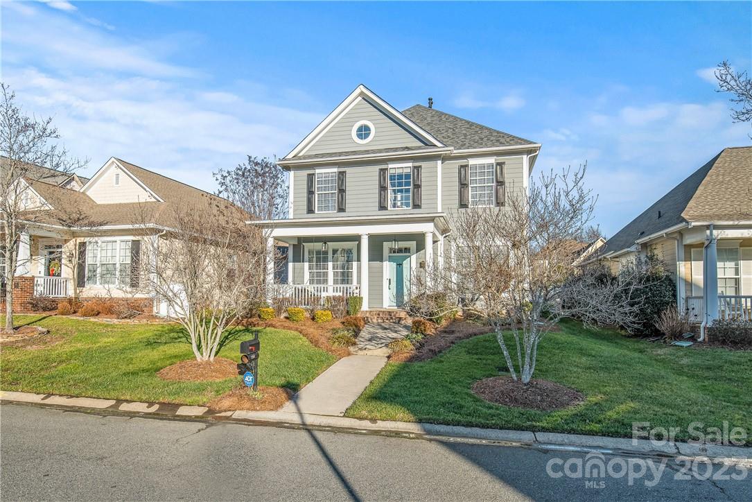 4108 Cedar Point Avenue Matthews, NC 28104 - Photo 36 of 41 a front view of a house with a yard and trees
